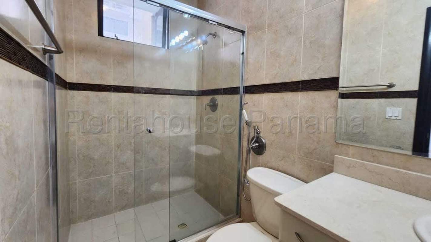 Master bedroom with ensuite bath, large window city ocean view Panama luxury condo