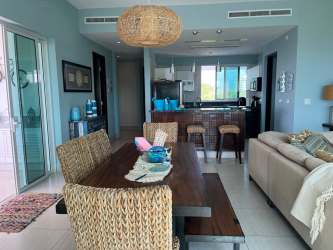 Bright bedroom with large windows and sea views at PH Punta Barco Resort