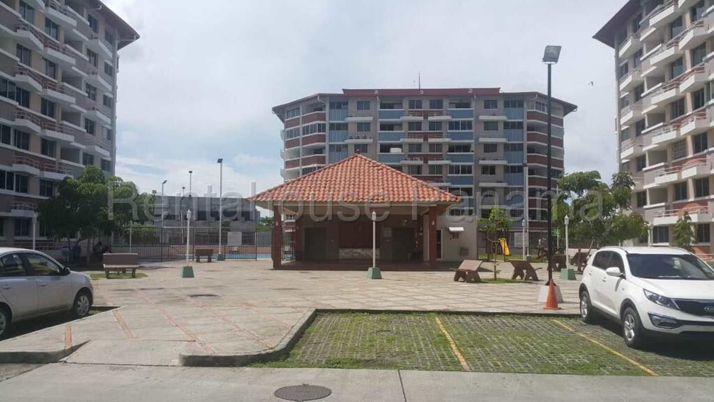 Outdoor sports tennis court, children’s playground and landscaped gardens in Panama apartment complex
