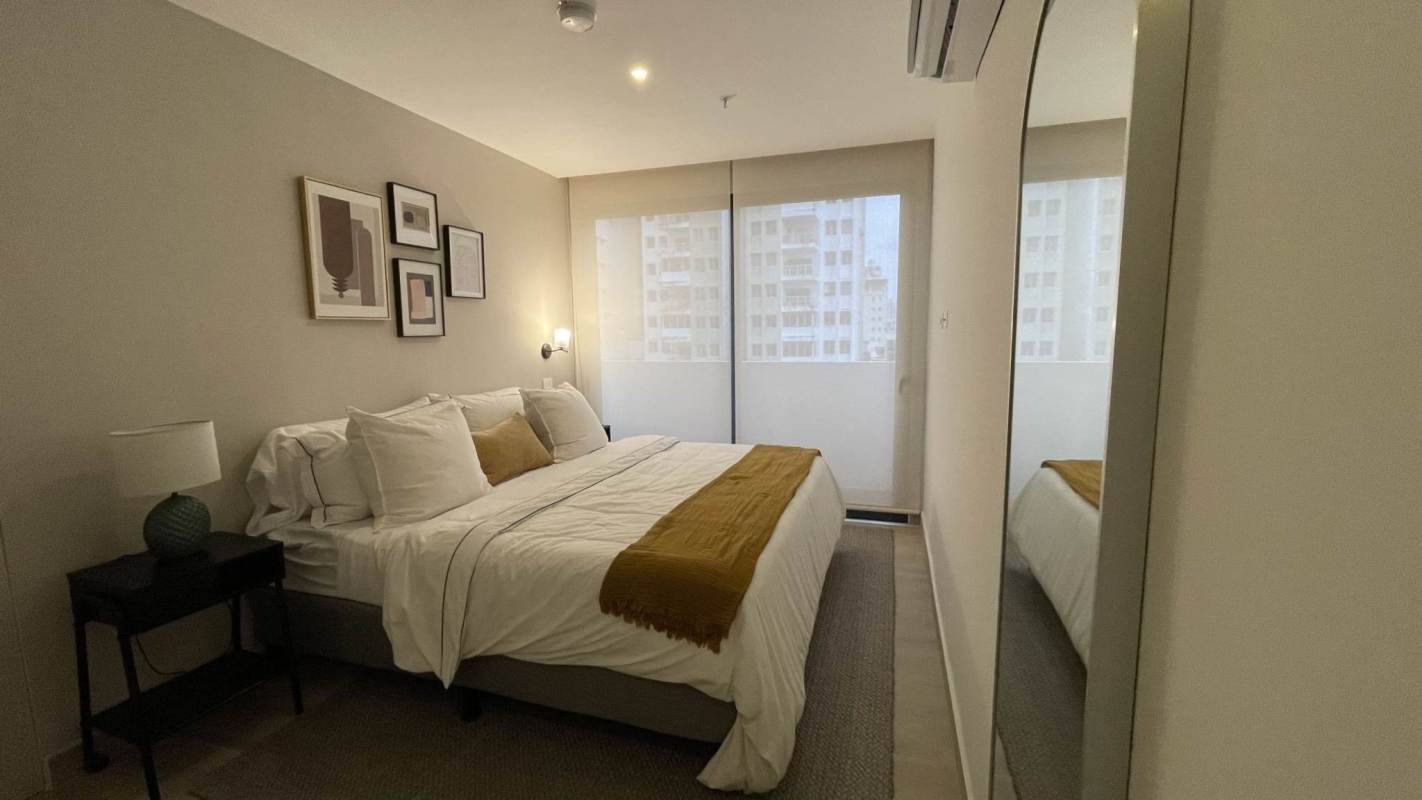 Bedroom with wall decor and city view PH Sky 66 San Francisco Panama