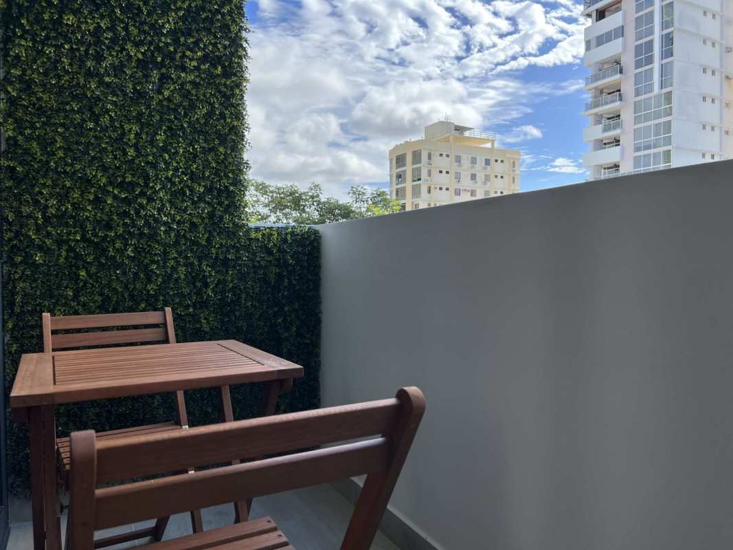 Cozy balcony overlooking Panama City skyline at Sky 66