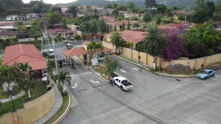 Gated residential community with security entrance and landscaped areas in Arraiján Panama