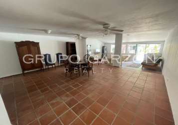 Rustic outdoor covered pergola BBQ area in APRUCC Coronado tropical beach house for sale