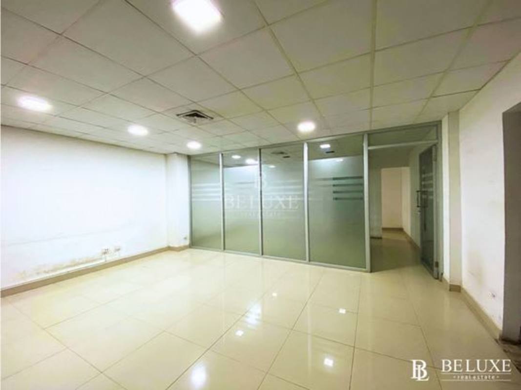 Interior of a minimalist glass office with tiled flooring at PH Plaza Obarrio commercial tower Obarrio
