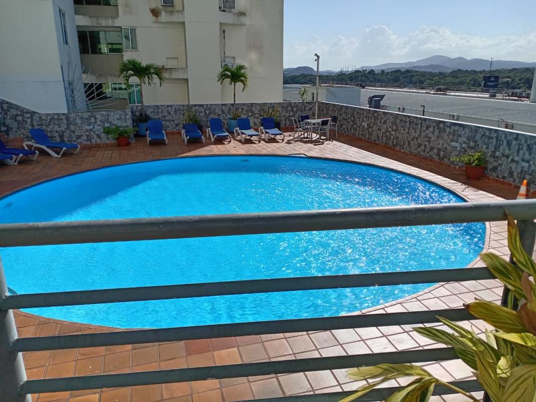 Community pool area with deck chairs in PH El Mare 400 Edison Park Panama
