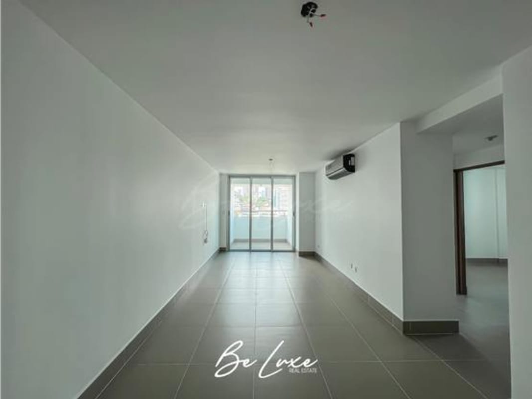 Modern bedroom with large windows natural light and city view at Altamira Residences Bella Vista Panama