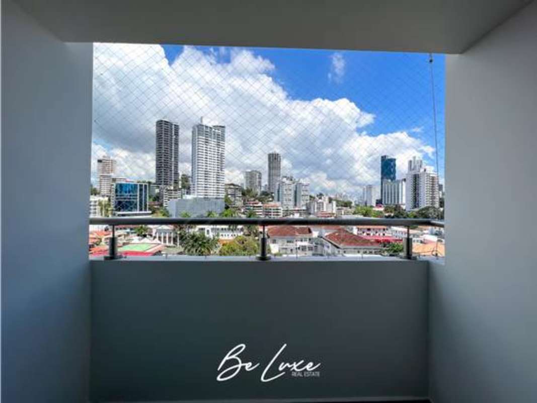 Balcony with glass railing overlooking Panama City skyline Altamira Residences Bella Vista