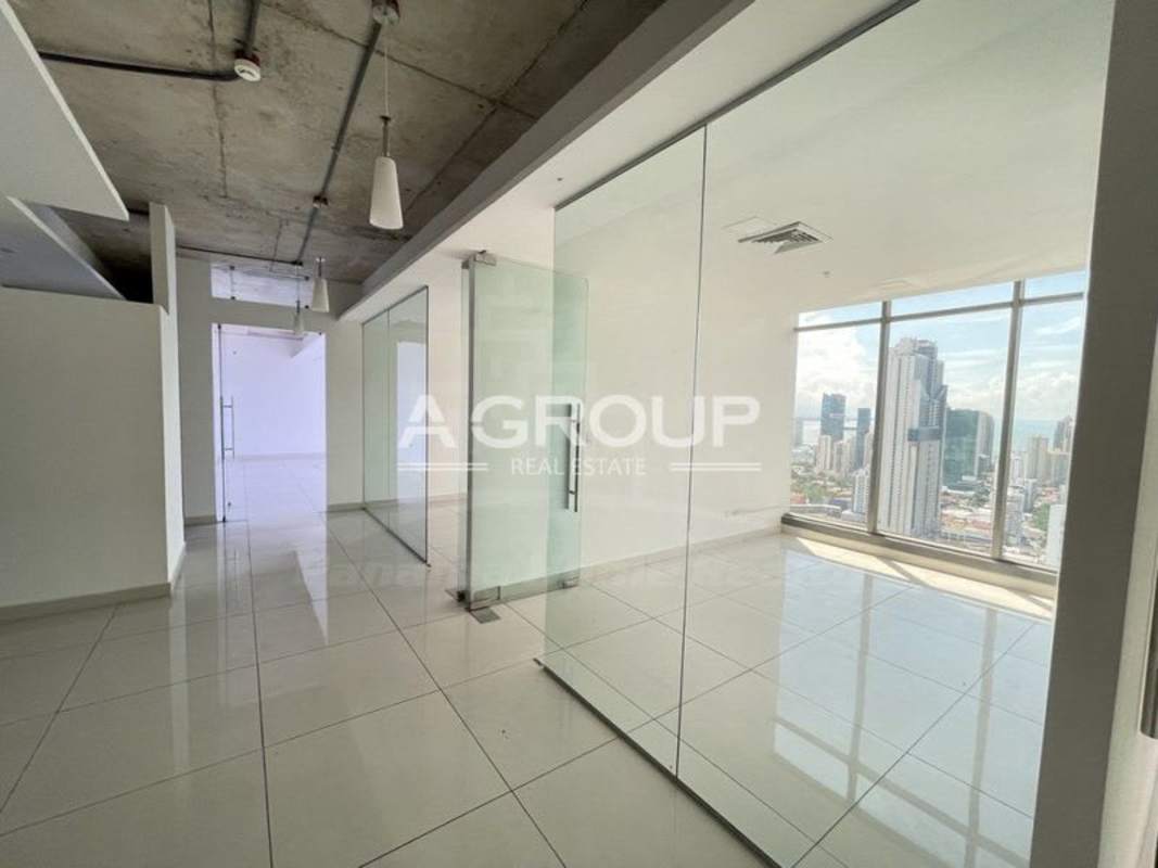 Modern office interior with glass walls and skyline views at BICSA Financial Center Panama City