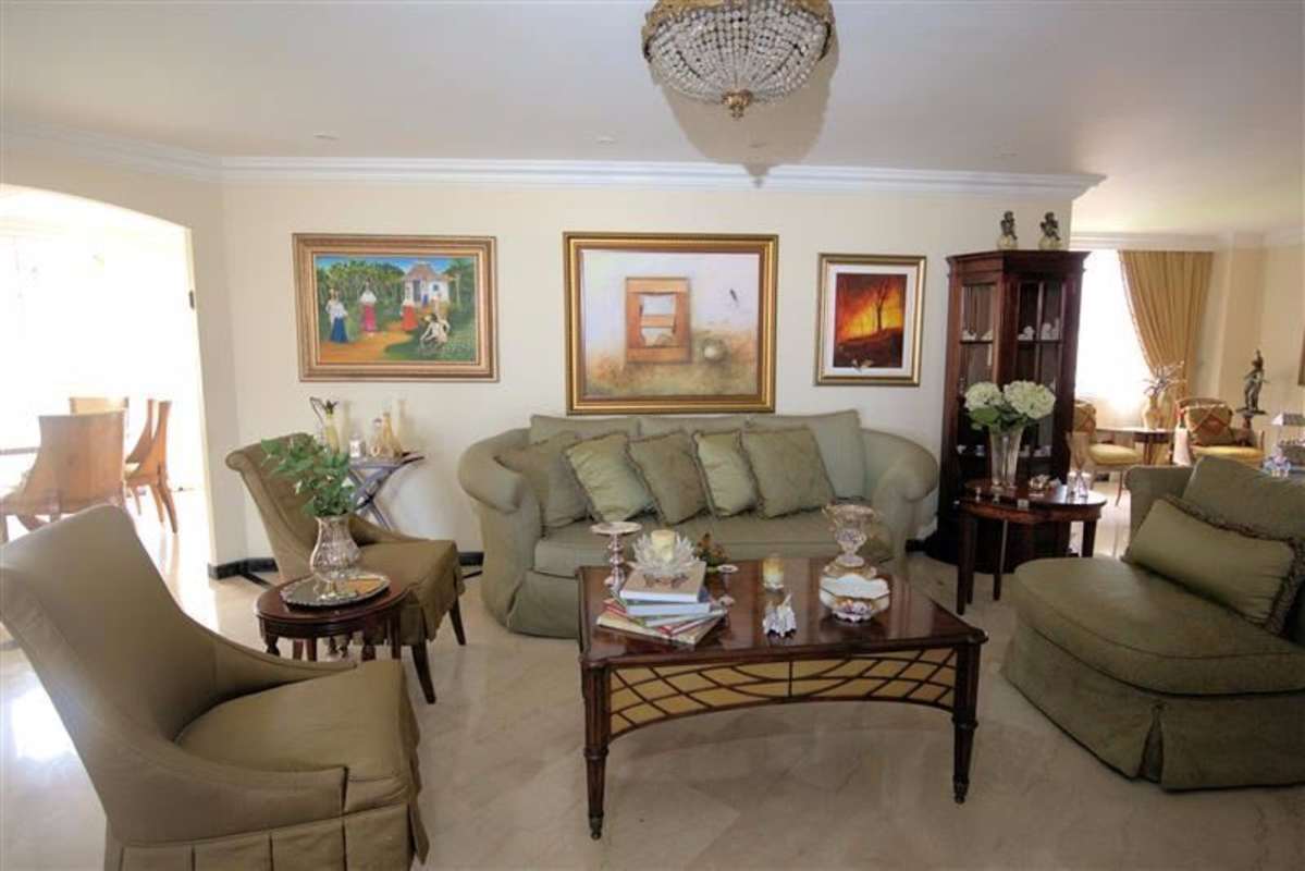 Elegant formal living area with traditional furnishings and skyline view at PH Lalique Punta Paitilla