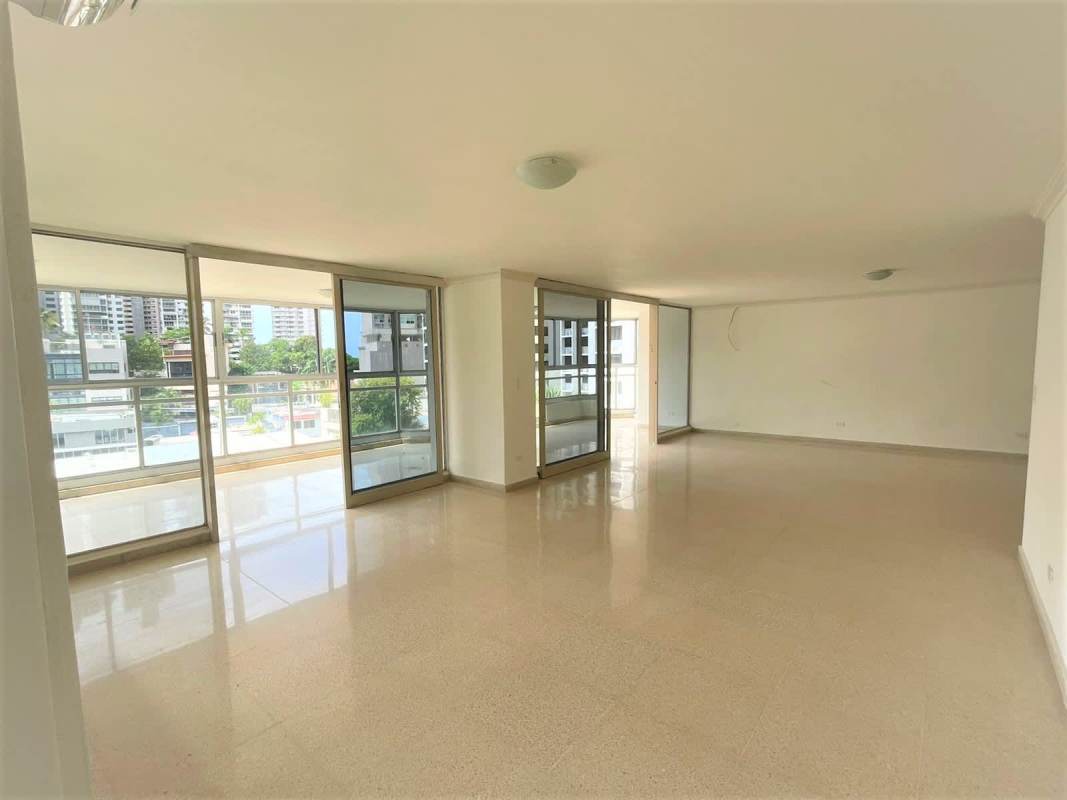 Spacious living area with marble floors and balcony access overlooking city PH Savoy