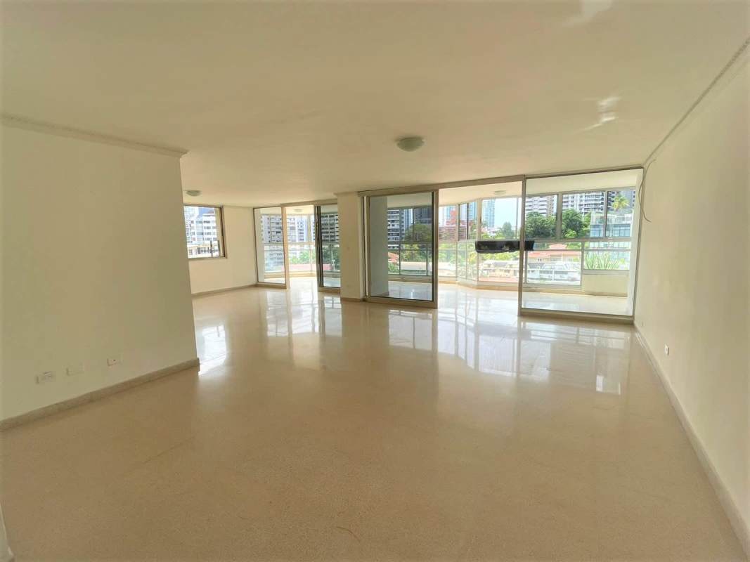 Spacious kitchen with white cabinets, island, tile backsplash in PH Savoy Punta Paitilla