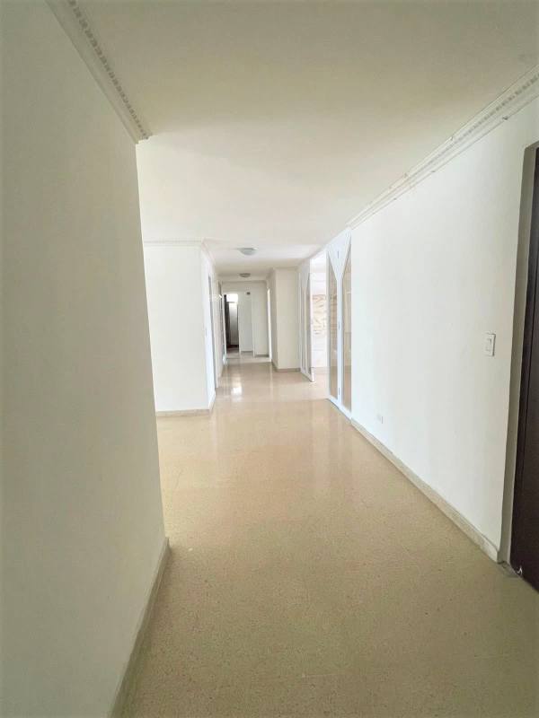 Empty living area with marble flooring and panoramic windows city view PH Savoy