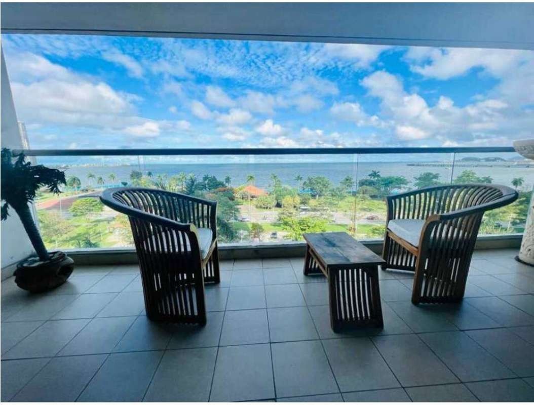 Designer furnished living area with balcony access and sea view in PH BICSA Panama