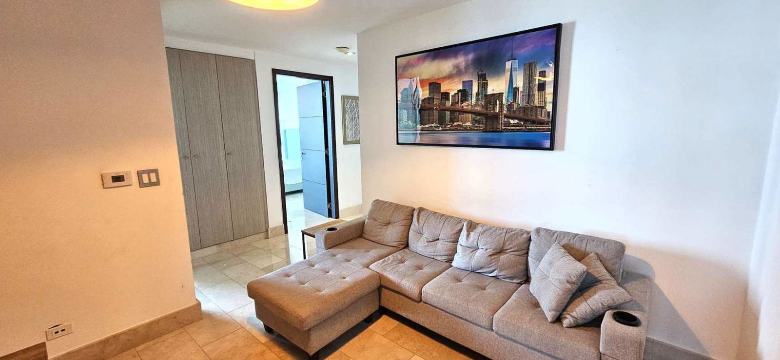 Master bedroom featuring windows with ocean and skyline views in PH Grand Tower Punta Pacifica Panama