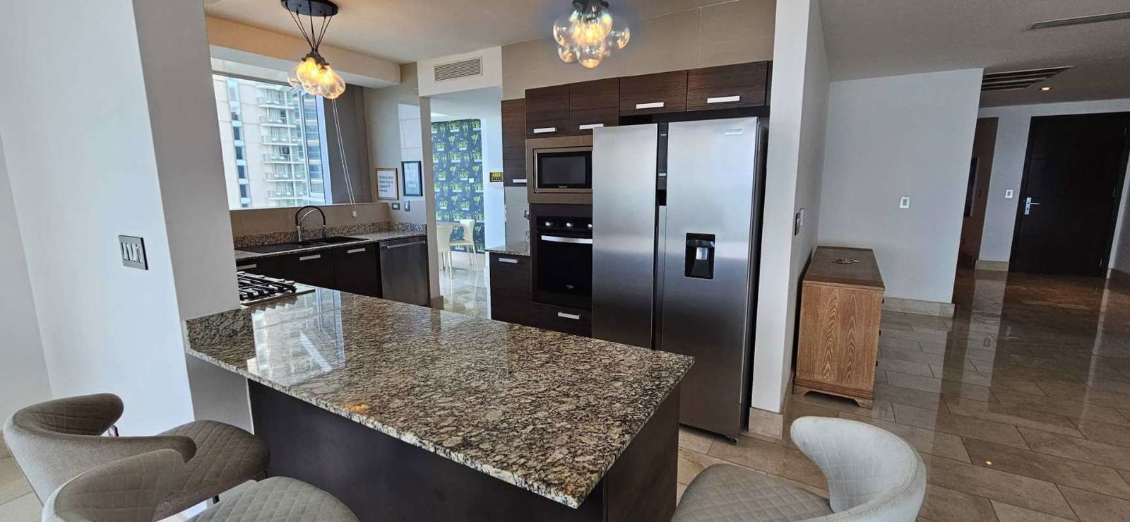 Bright spacious bedroom with marble floors and private bath at PH Grand Tower Panama