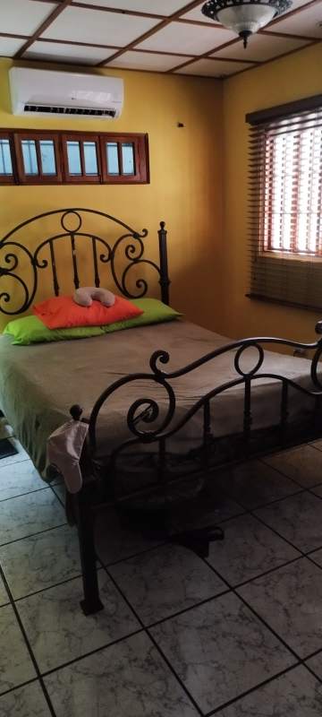 Bathroom with glass block shower, black toilet and sink in house for rent Coco del Mar Panama