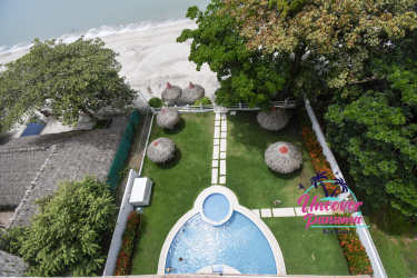 Infinity pool with lush tropical surroundings in Miramar Loft beachfront condominium Farallón Panama