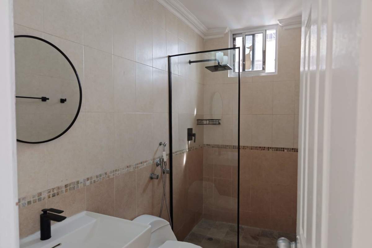 Modern bathroom with shower, tiled walls, elegant fixtures PH Fairmont Plaza Panama City