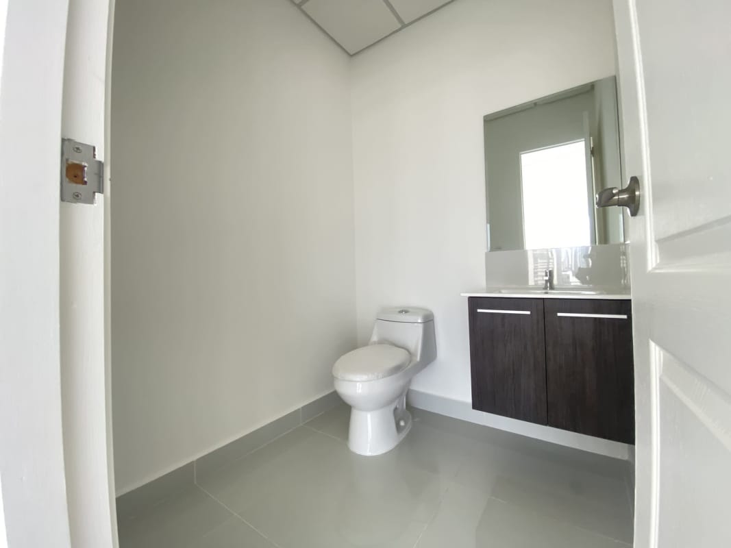 Office interior with glass windows and skyline ocean views at PH Interplus Avenida Balboa Panama City