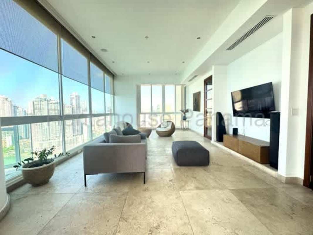 Contemporary kitchen with island, wood cabinetry, stainless appliances in PH Ocean One Punta Pacifica Panama