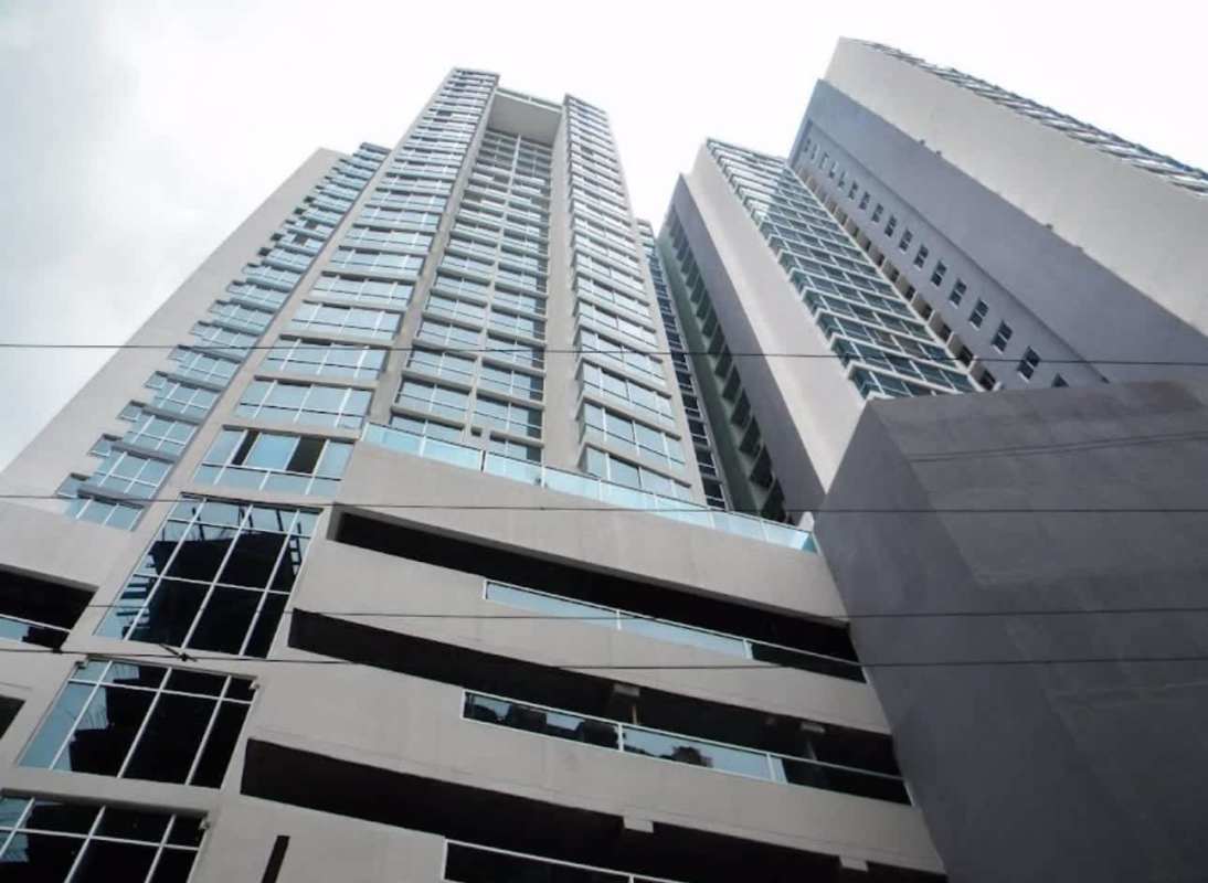 Exterior view of PH Carrasquilla Park tower facade with glass balconies Panama City