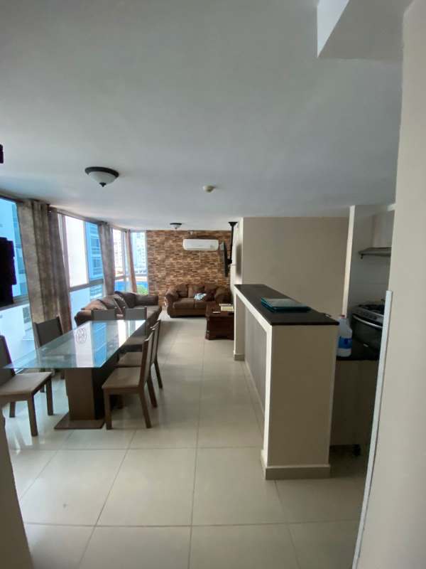 Bright living dining area with integrated kitchen, large windows in PH Carrasquilla Park, San Francisco Panama