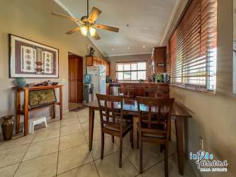 Light-filled dining area with wood cabinets and vaulted ceilings Boquete condo