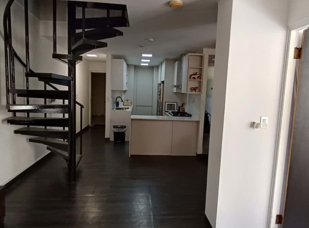 Modern minimalist kitchen with black spiral staircase PH Nuevo Hato Pintado Panama