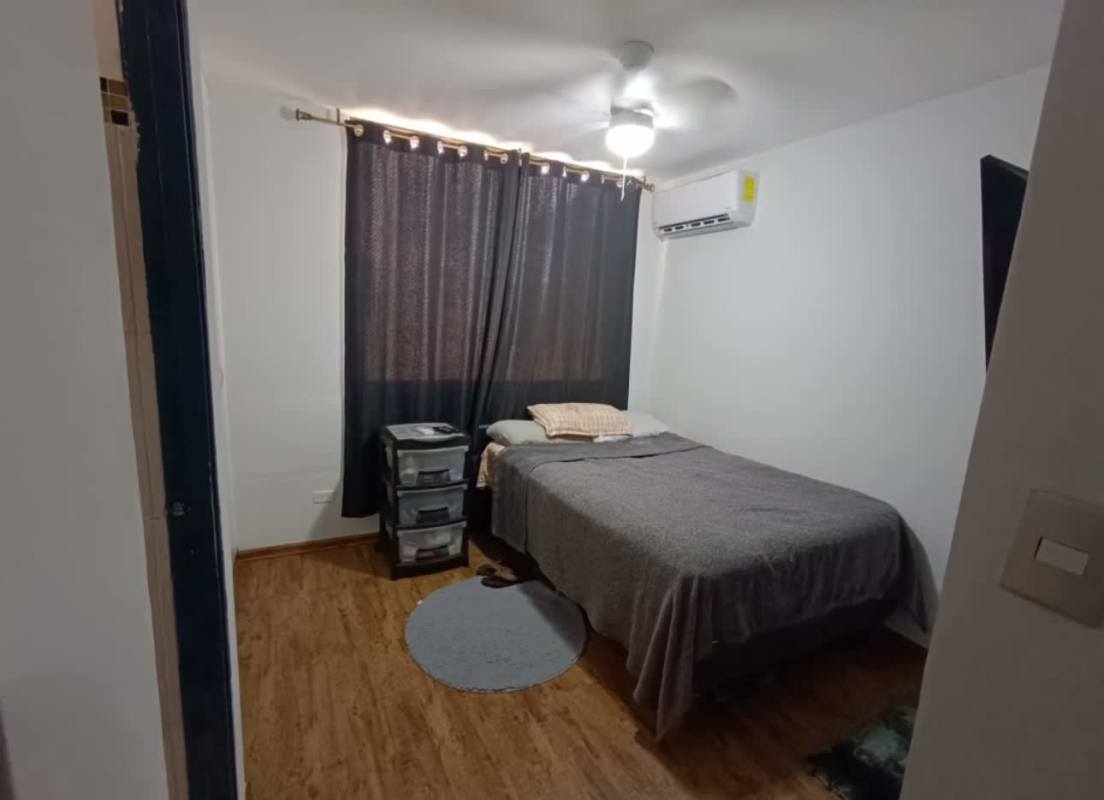 Bright bedroom with bed, curtains, ceiling fan and AC in PH Nuevo Hato Pintado Panama