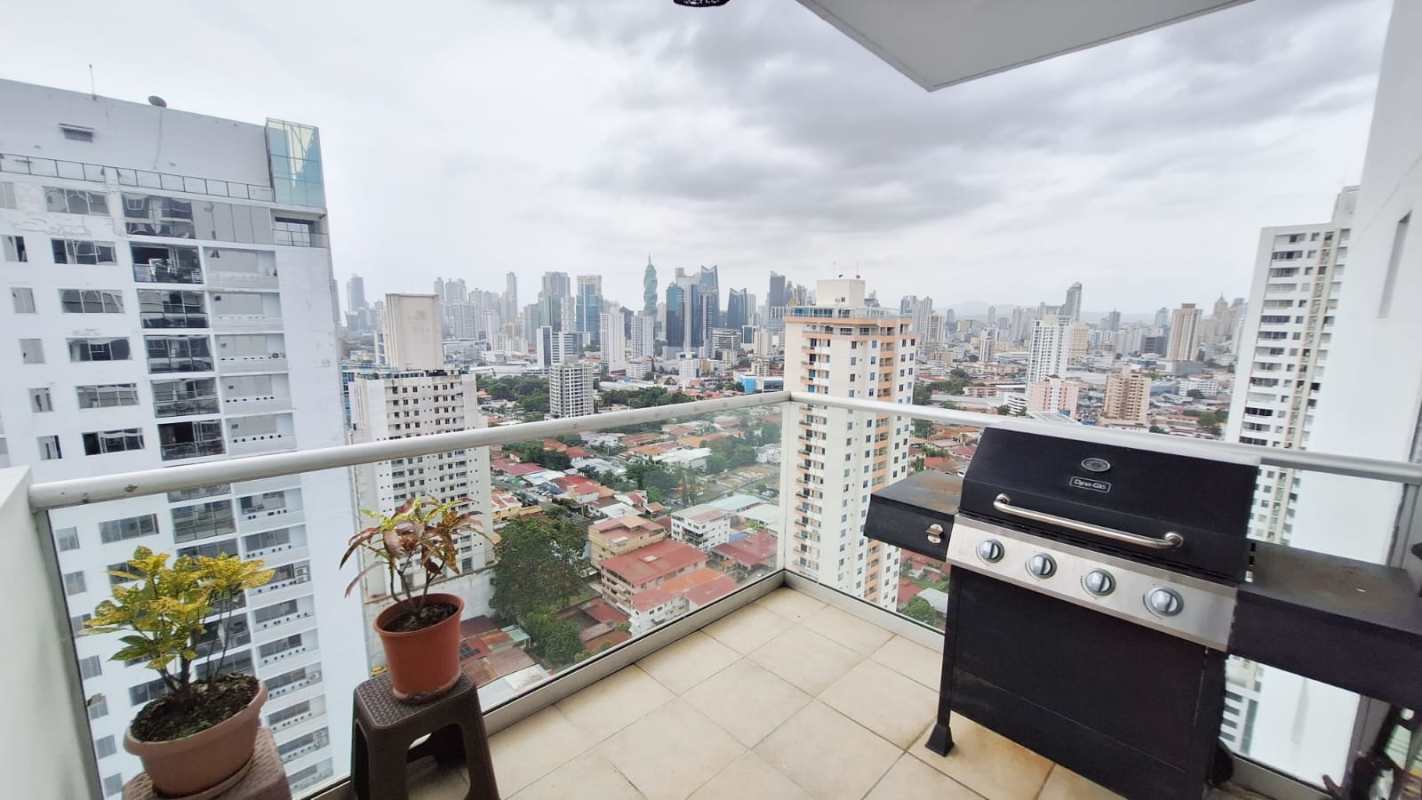 Kitchen with granite countertops, dark cabinetry, and stainless steel range hood at PH Window Tower