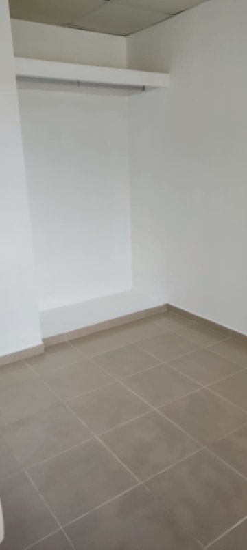 Basic tiled kitchen with sink, stove space, backsplash in double lot house for sale Chilibre Panama