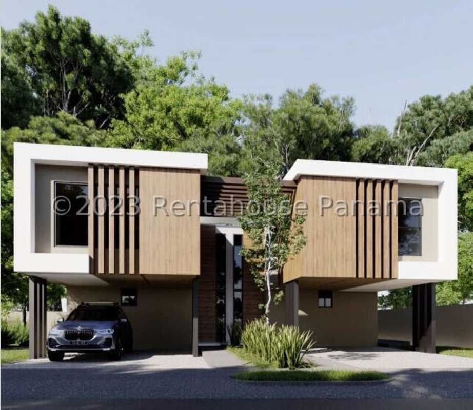 Newly built modern house under construction in Albrook area with large windows amid greenery
