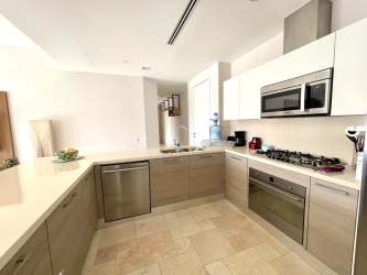 Modern open kitchen with quality cabinetry and stainless appliances at PH Puntarena Buenaventura