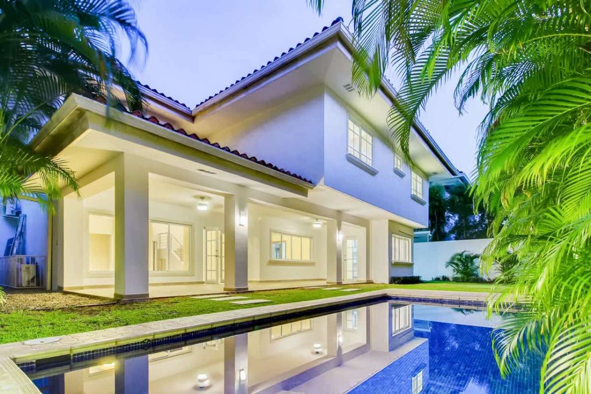 Private backyard swimming pool and garden at luxury house Costa del Este Panama