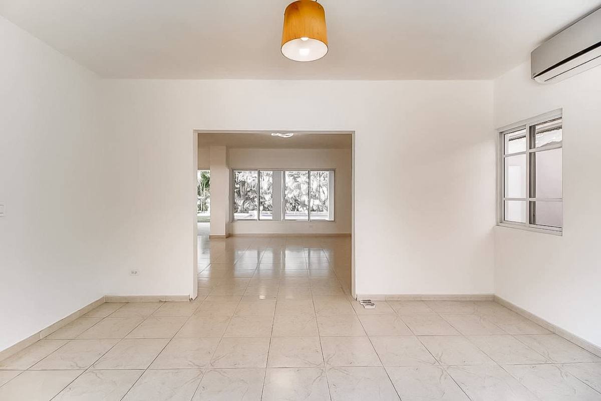 Large bright living area with tile floors and garden access Costa del Este Panama
