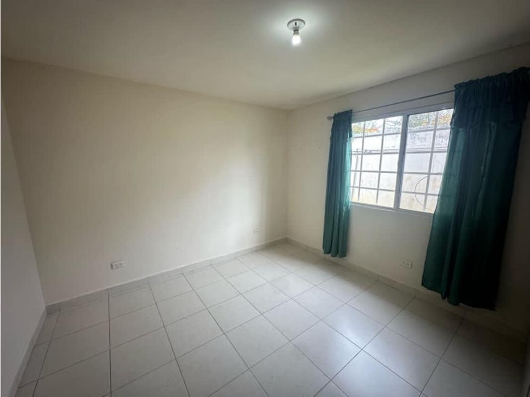 Empty bedroom with tiled floors and wardrobe at Islas de Montelimar Costa Verde Panama