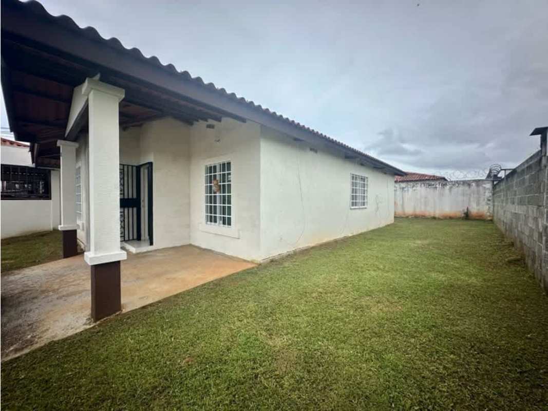 Spacious living room with bright windows and tiled floors at Islas de Montelimar Costa Verde Panama