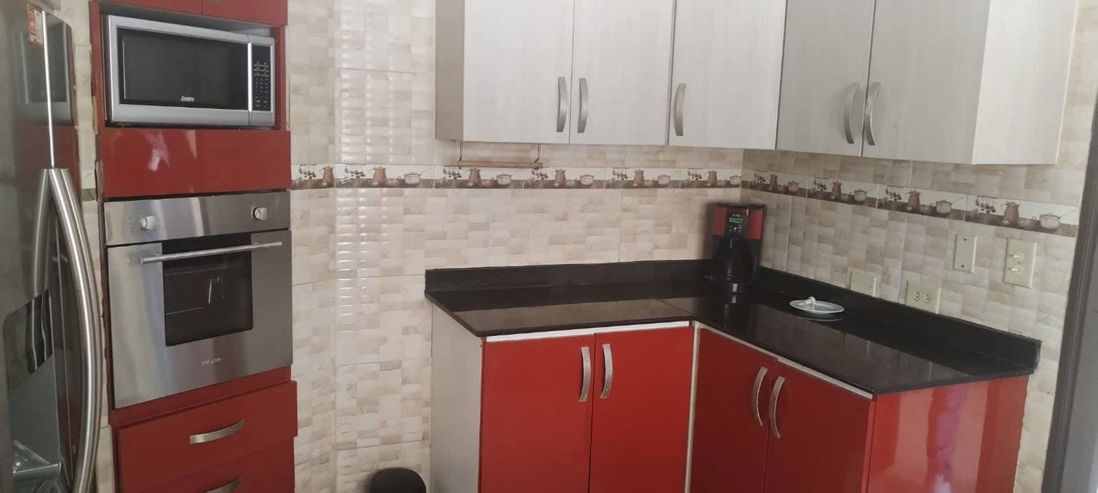 Interior staircase with wood railing and glass block window wall Fuente del Fresno house Panama City