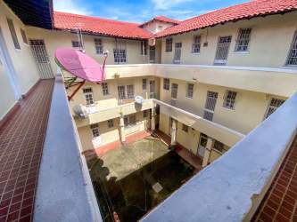 Multi-story residential building with balconies and courtyard for sale Colón Panama