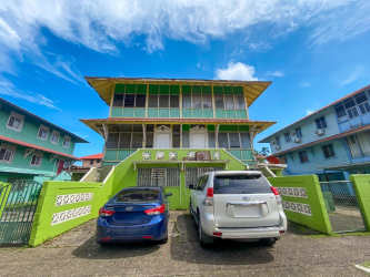 Front exterior of multi-level commercial residential green building for sale in Colon Panama