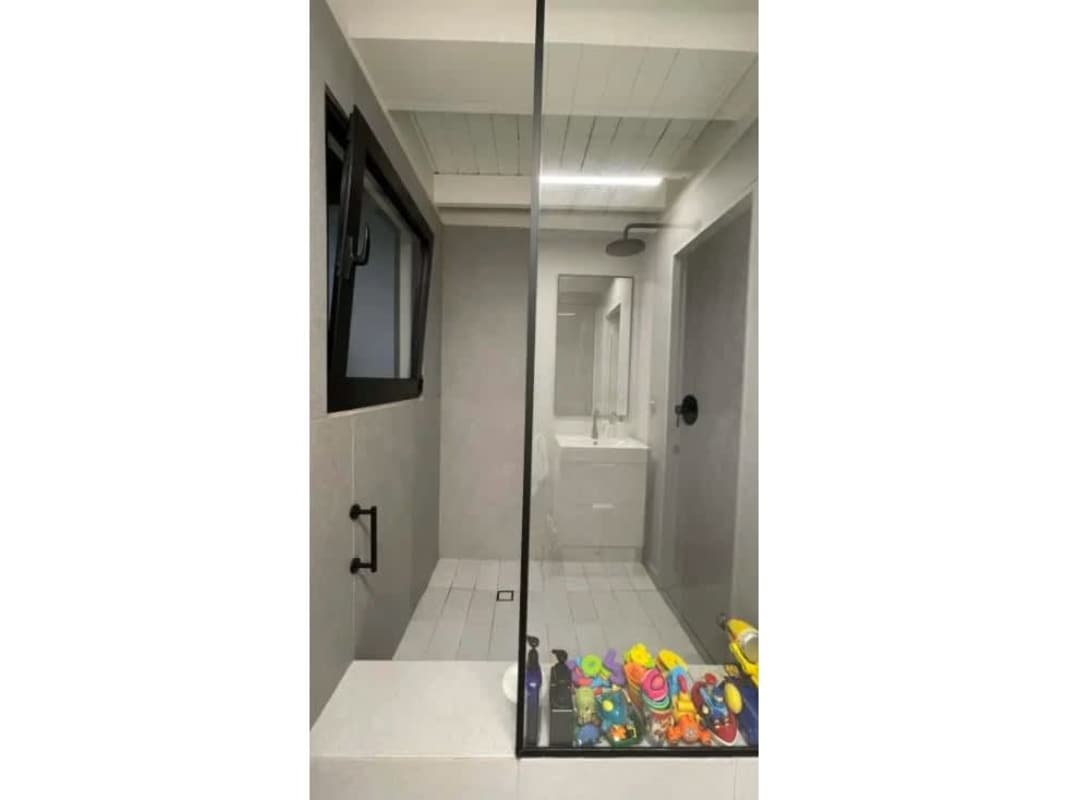 Modern infinity pool surrounded by lush tropical landscaping in Cardenas Ancon Panama City