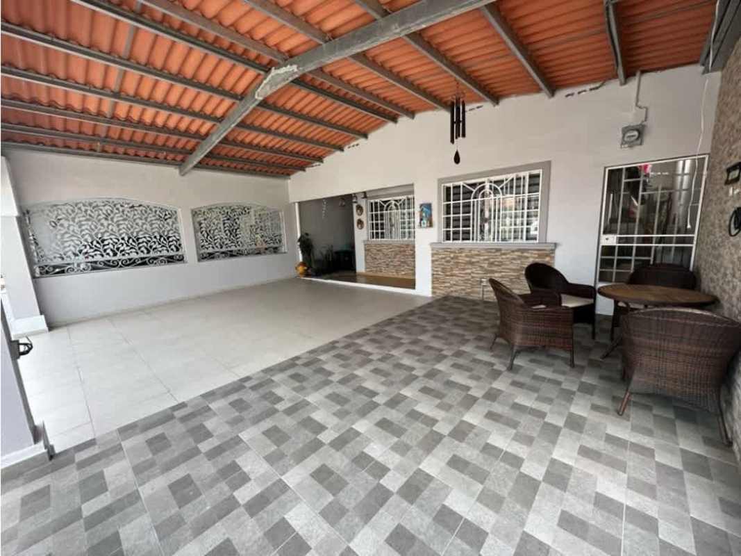Covered porch with brick accents, hanging decor, security bars, and plants in Punta del Este Tocumen