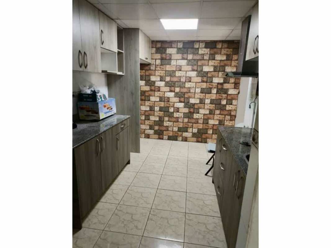 Upgraded small bathroom with beige tile, glass shower door at Punta del Este Tocumen