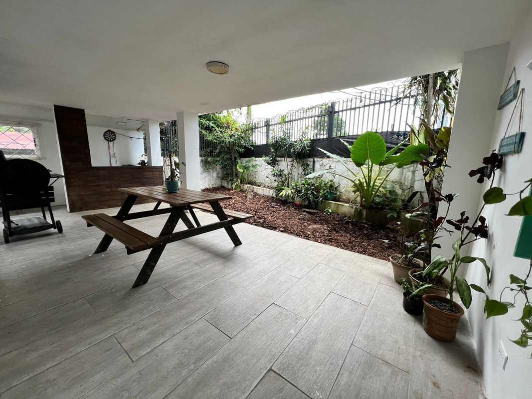 Open dining and living area with modern furnishings in duplex house Coco del Mar Panama
