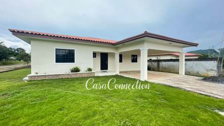 Kitchen with granite countertop, wood cabinets, appliances in corner house David Panama