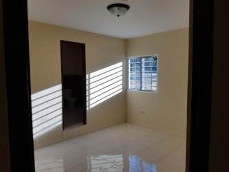 Front yard and single story home for sale in San Carlitos David Panama