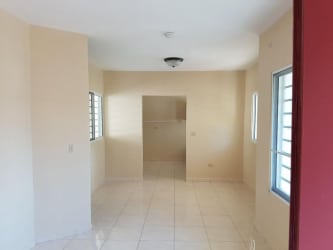 Bathroom with glass shower, ceramic tiles and fixtures in San Carlitos David house for sale
