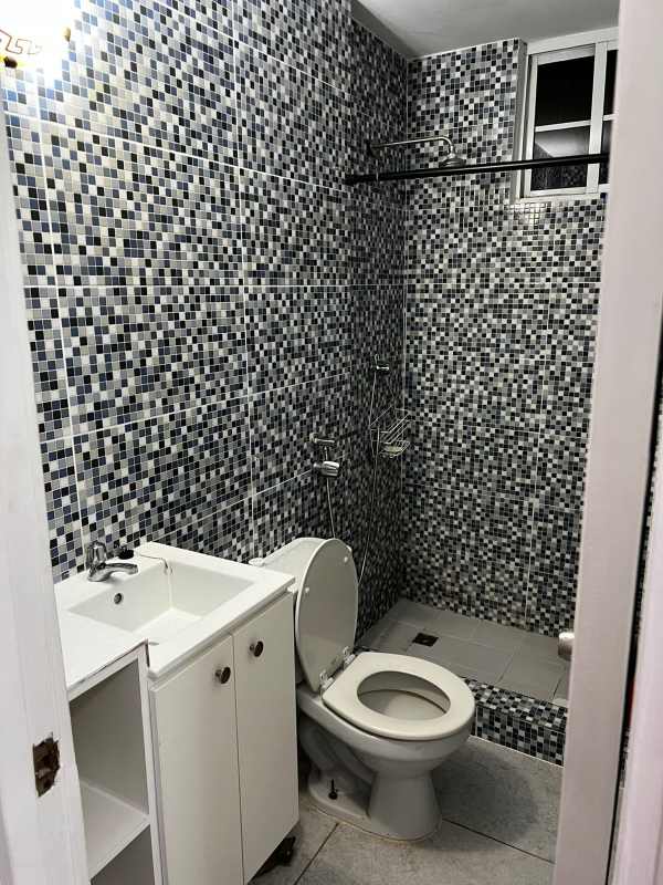 Contemporary bathroom featuring mosaic tiled walk-in shower and vanity in PH Mystic Hills Panama