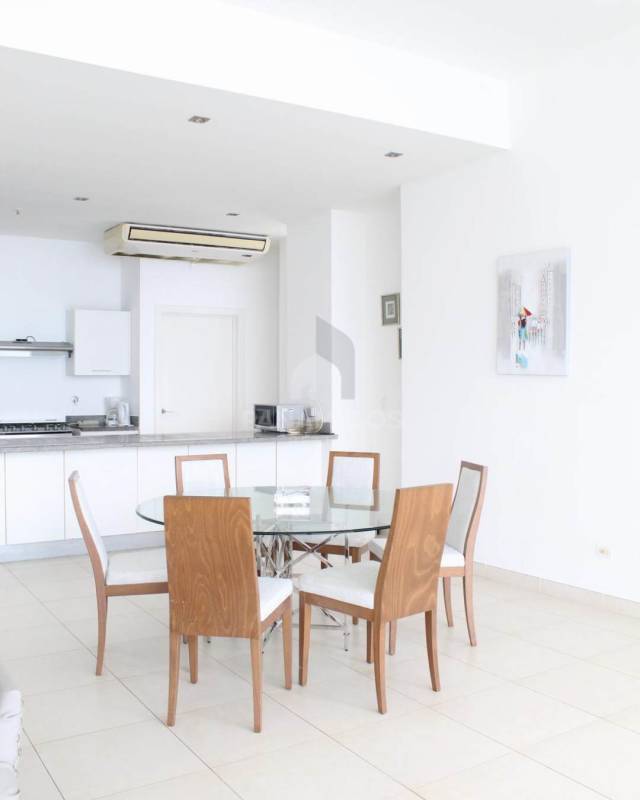 Spacious bedroom with large windows, Pacific ocean views in luxury apartment Waters On The Bay Panama