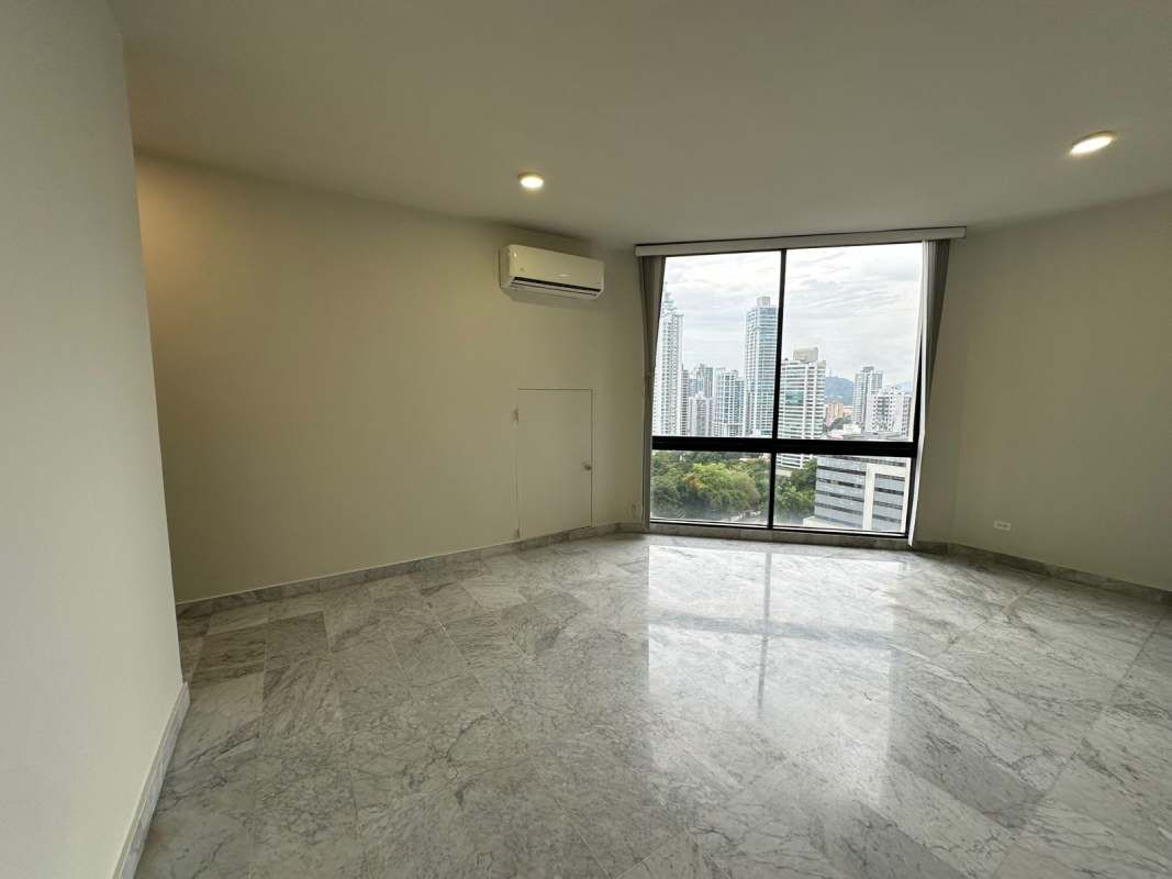 Spacious closet with shelving and bifold doors in bedroom Vista Tower Panama.